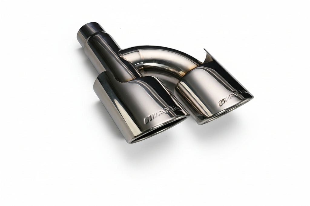 Chrome car exhaust tip on a gray background