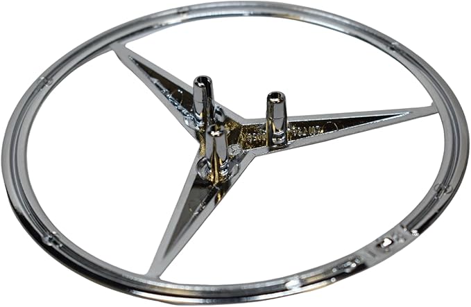 Chrome Mercedes Benz emblem with star design on a white background