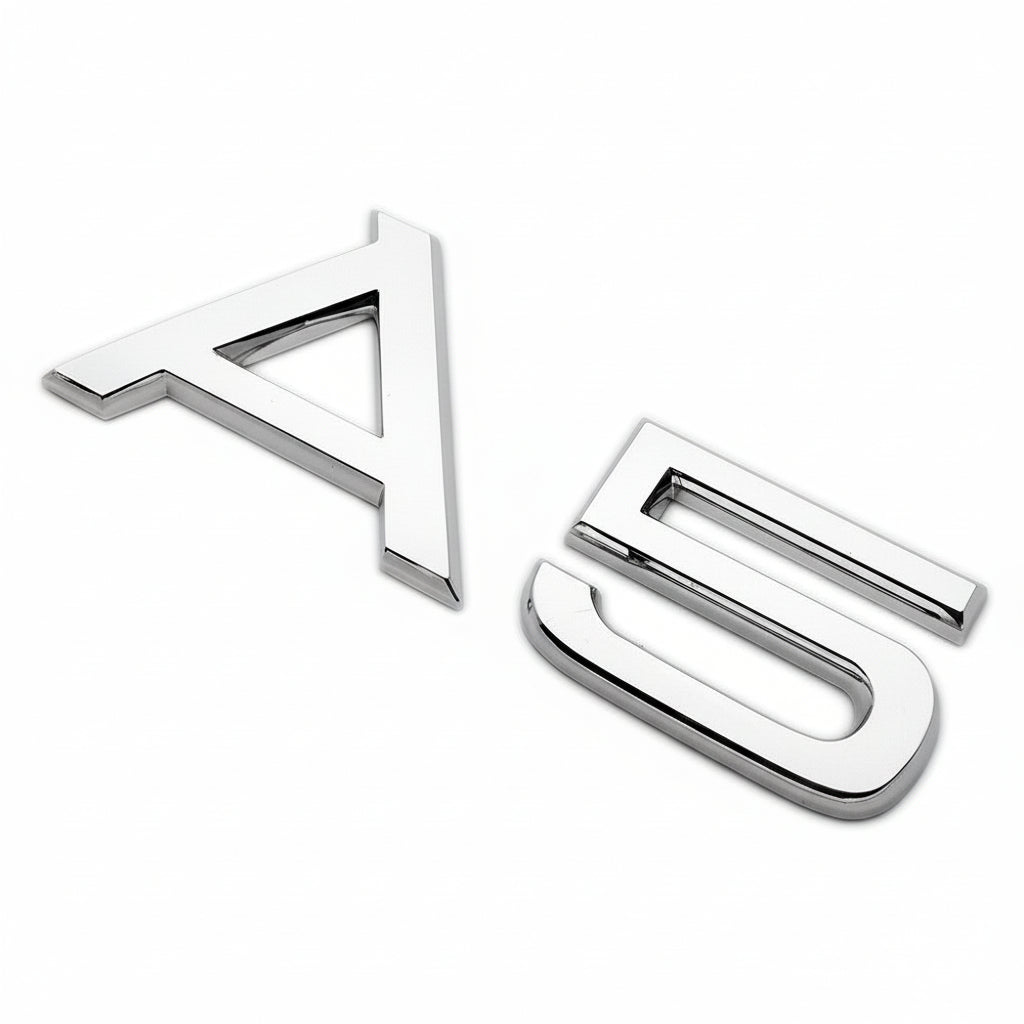 Chrome 'A5' car emblem on a white background